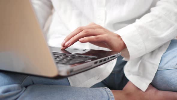 Girl Student Works At A Portable Computer Laptop. The Student Is Typing Creates A Letter Text alt