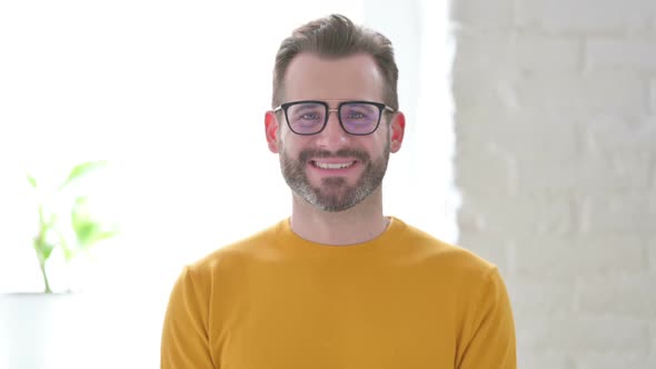 Portrait of Attractive Man Smiling at Camera alt