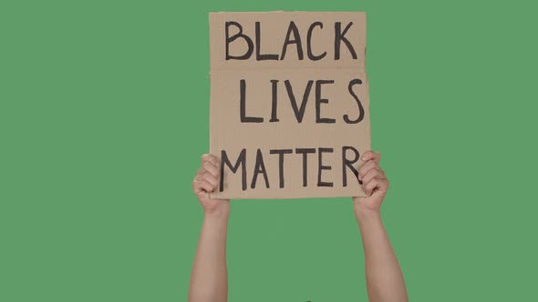 Showing Cardboard Poster with Inscription BLACK LIVES MATTER. Human Rights Demonstration. Hands alt