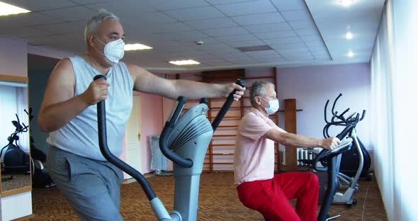 Man’s in the Gym Perform Strength Exercises alt
