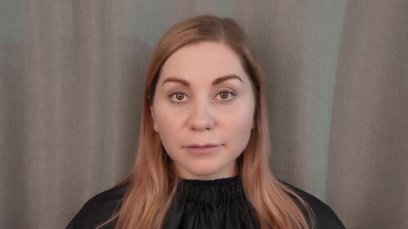 Beautiful Woman Looks Straight alt