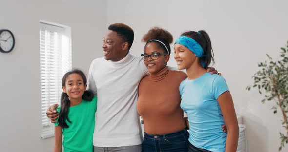 The Happy Family is Spending Time in Newly Rented Purchased Apartment They are Standing in Middle of alt