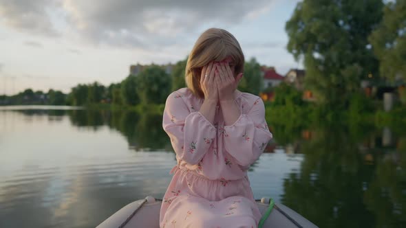 Modest Caucasian Transgender Woman Laughing Closing Face with Hands Looking at Camera alt