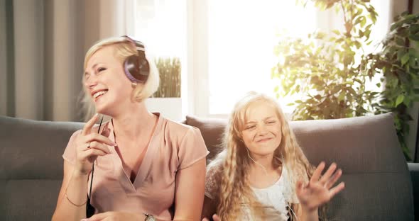 Mother and Daughter Listening To Music