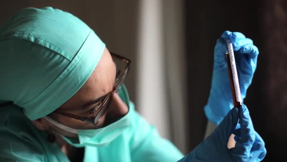 Doctor holding a coronavirus COVID-19 test tube