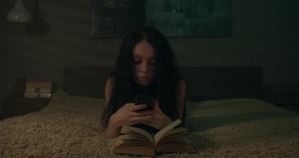Bored Young Woman With Smartphone
