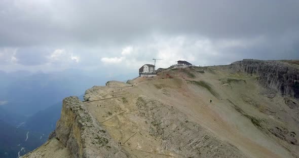 Aerial drone view of a group of people hiking in the mountains alt