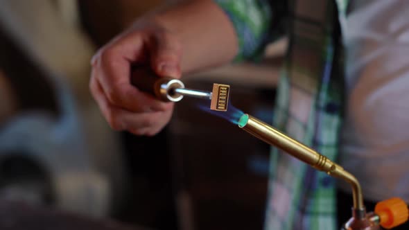 The Heating of the Stamps for Marking Wood. A Gas Burner That Heats Markers for Marking and Branding alt