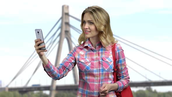 Pretty Girl Recording Video on Her Smartphone alt