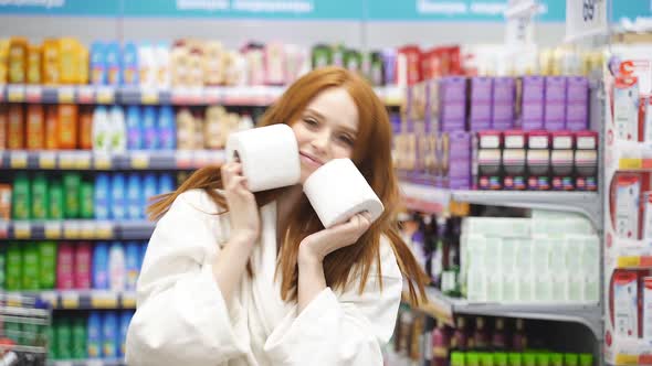 Happy Caucasian Woman with Red Hair Choosing the Best Toilet Paper
