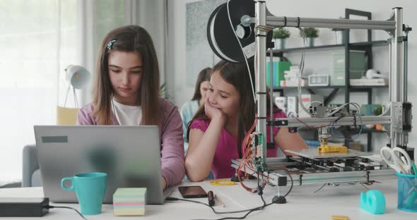 Children studying together at home and learning 3D printing