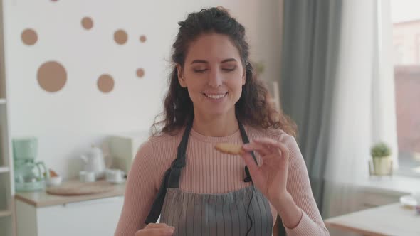 Female Vlogger Tasting Homemade Cookie, Stock Footage | VideoHive