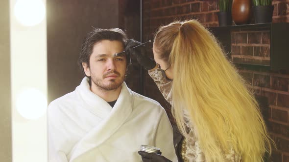 Young Stylish Man in a Beauty Salon. Face and Eyebrow Care alt