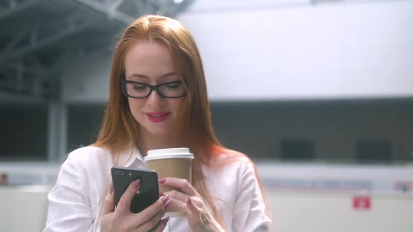 successful businesswoman standing in office lobby enjoying conclusion contract alt