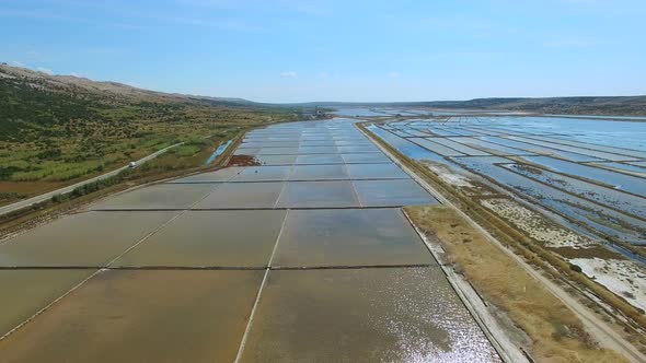 Flying above salt evaporation ponds on Pag island, Croatia alt