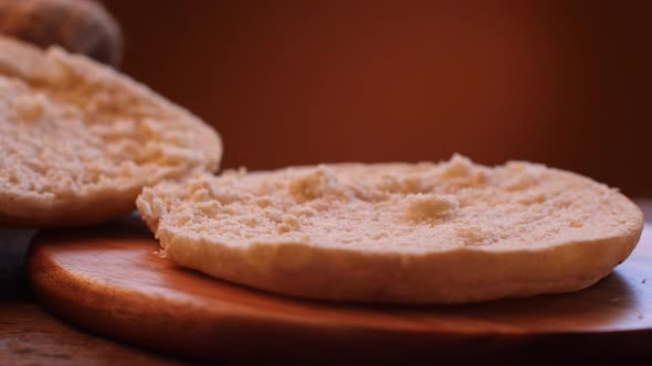 Italian mortadella sandwich on wooden cutting board