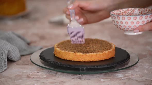 Soaking a Sponge Cake Layer with Coffee