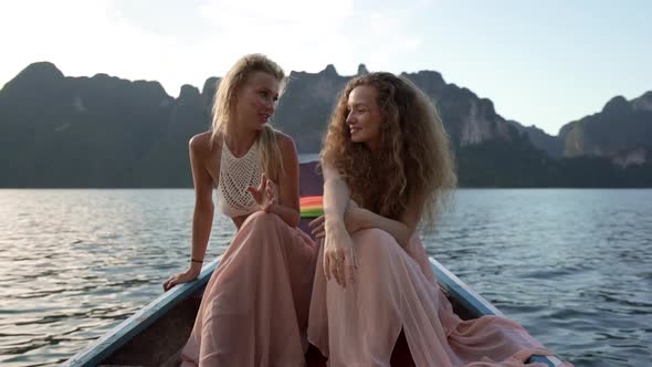 Girls Talking While Riding on Boat alt
