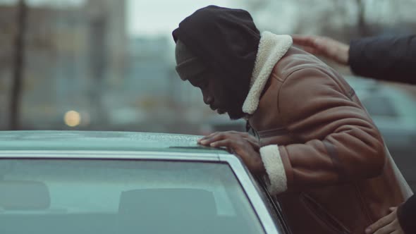 Black Man Being Searched by Police alt
