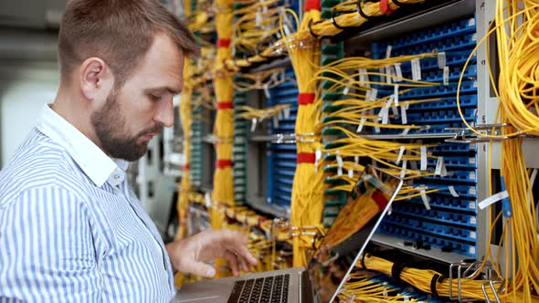 Engineer Working in Data Room alt