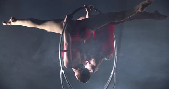 Upside Down Split on a Hoop Two Pretty Women Doing Gymnastics alt