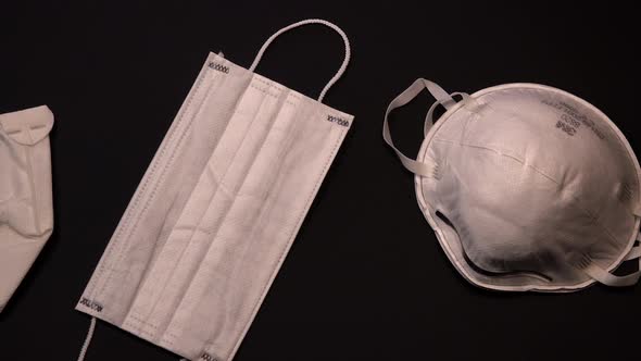 Protective medical equipment during a virus epidemic, Surgical mask on black background