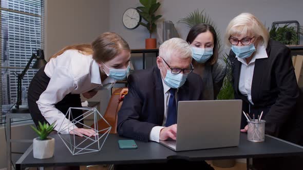 Group Business People Communicate Working with Laptop in Office in Masks During Coronavirus Pandemic alt