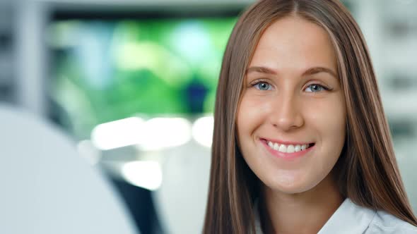 Portrait of Attractive Happy Businesswoman in the Modern Office or Lab alt