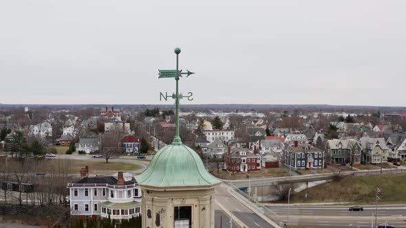 North South arrow metal sign above residential town church Pawtucket, Rhode Island alt