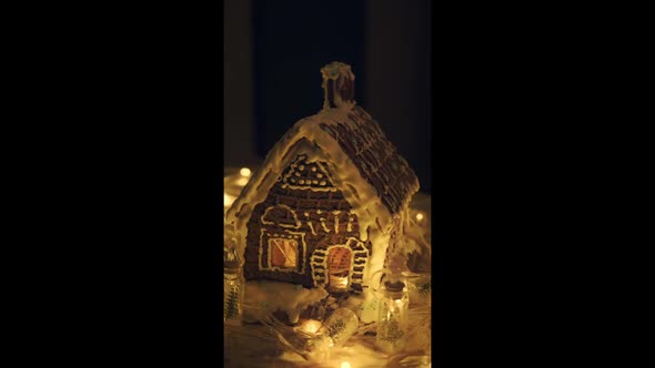 Christmas Gingerbread House Christmas Lights in Low Key Vertical Video alt