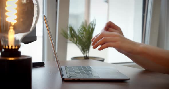 Female Hands Using Typing on Laptop Notebook Keyboard Sit at Home Office Desk Working Online Close alt