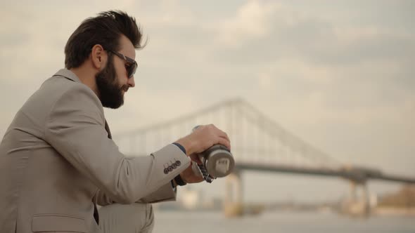 Businessman In Sunglasses. Man Enjoying Holiday And Drinking Coffee. Businessman Drinking Tea. alt