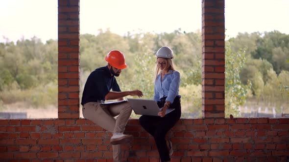 Developer On Construction Site. Civil Engineer Architect On Construction. Two Engineer Builder. alt