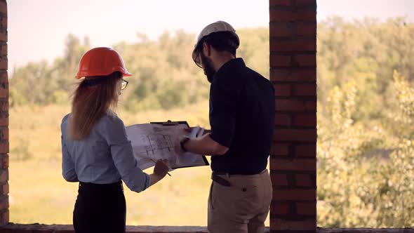 Engineer Developer Talking On Building Constructor.Two Architects Inspecting Building.Architect. alt