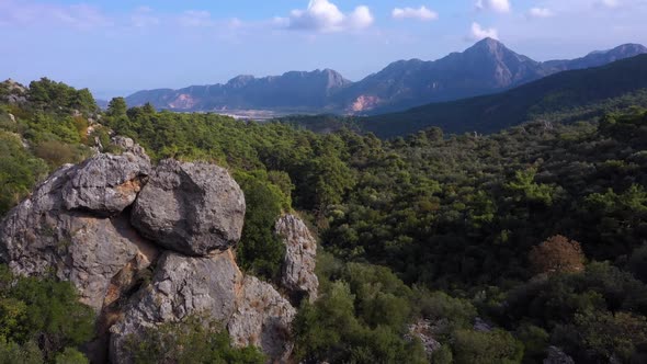 Aerial Panoramic View of Green Mountains on a Cloudy Day alt