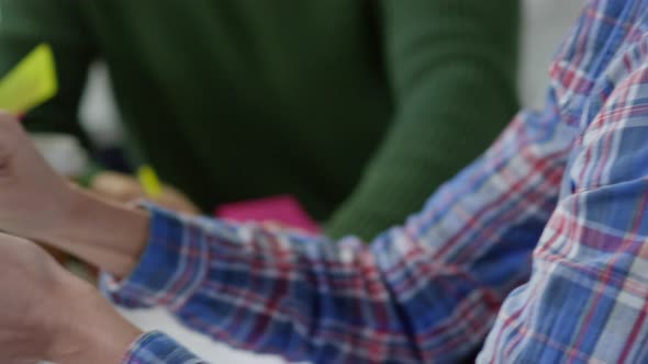 Female Manager with Tablet Discussing Plan alt