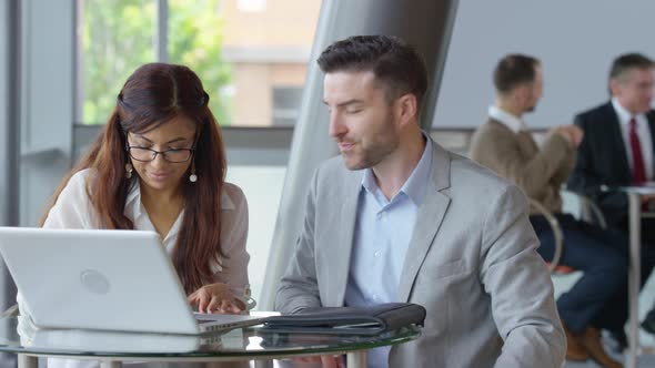 Businesspeople meeting in office lobby