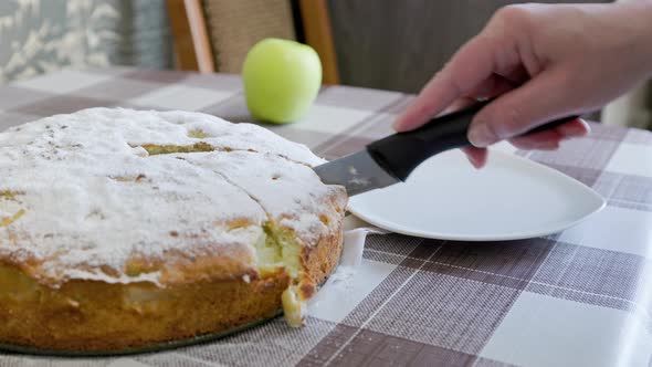 Caucasian Woman Cut Triangular Slice of Classic Apple Pie and Serving on White Plate