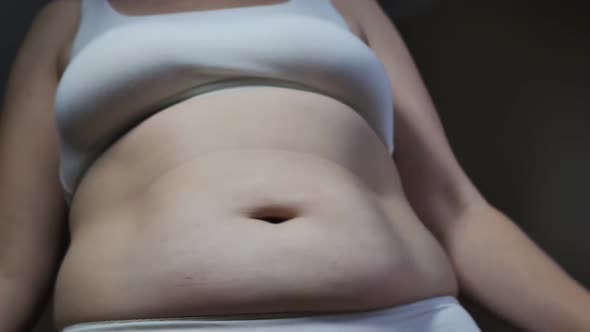 Overweight Caucasian Woman in Underwear Shaking Belly Fat