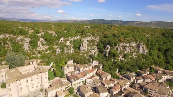 Aerial travel drone view of Balazuc, Southern France. alt