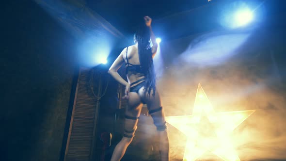 Beautiful Woman In Black Lingerie With Sword And Leather Belt Domination And Dance Night Club Scene alt