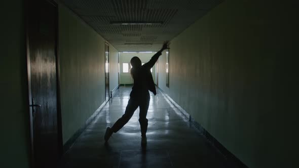 Female Silhouette Dancing Contemp In Hallway