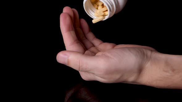 Prescription Medication Pills Being Poured into a Drug Addict's Hand, Slow Motion alt
