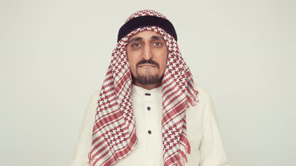 Modern Arab in the Office. The Bearded Man Exhales Happily. Both Hands Raised Up and Fists Clenched alt