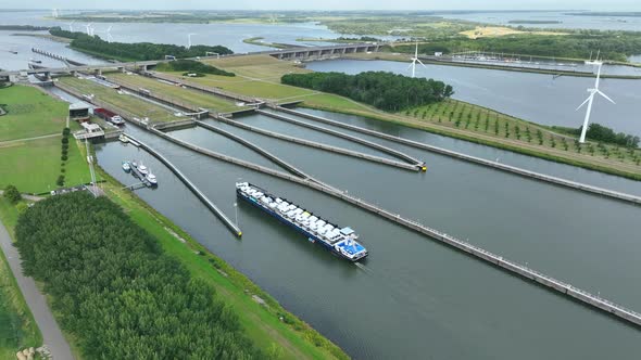 Vehicles Transported by Boat Entering the Volkerak Lock in the Netherlands alt