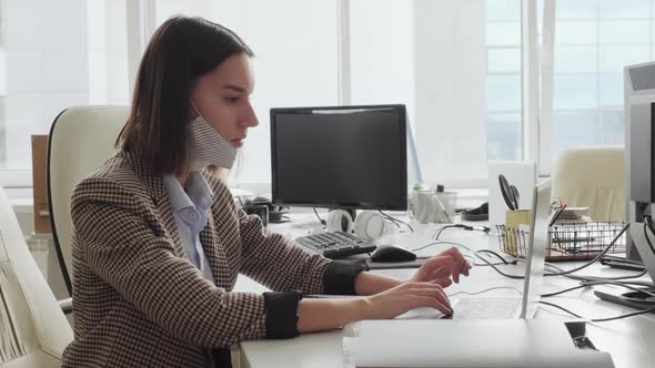 Businesswoman Working in Office during Covid-19 Pandemic alt