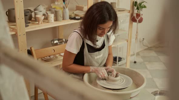 Female Artist Making Clay Pot