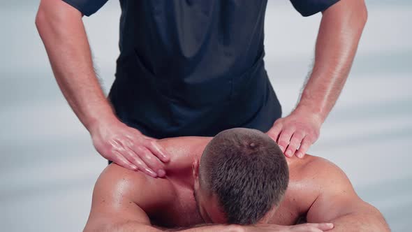 Sports Massage. Man Has Deep Tissue Massage on the Back