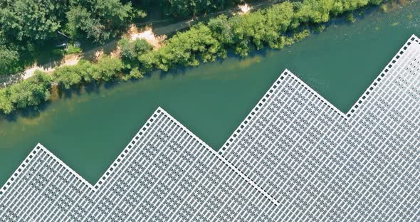Aerial View Renewable Energy Technology in Solar Panels Floating in Pond alt