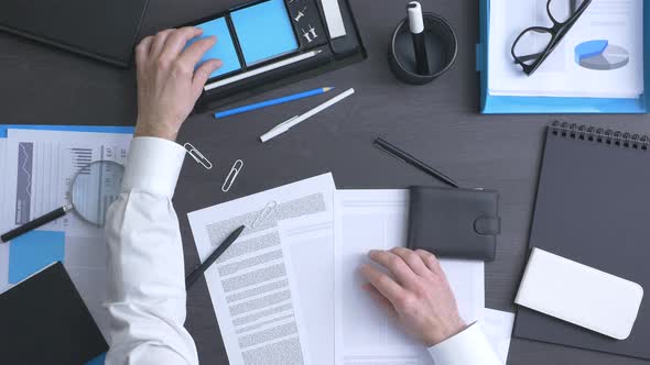 Businessman tidying up his desk